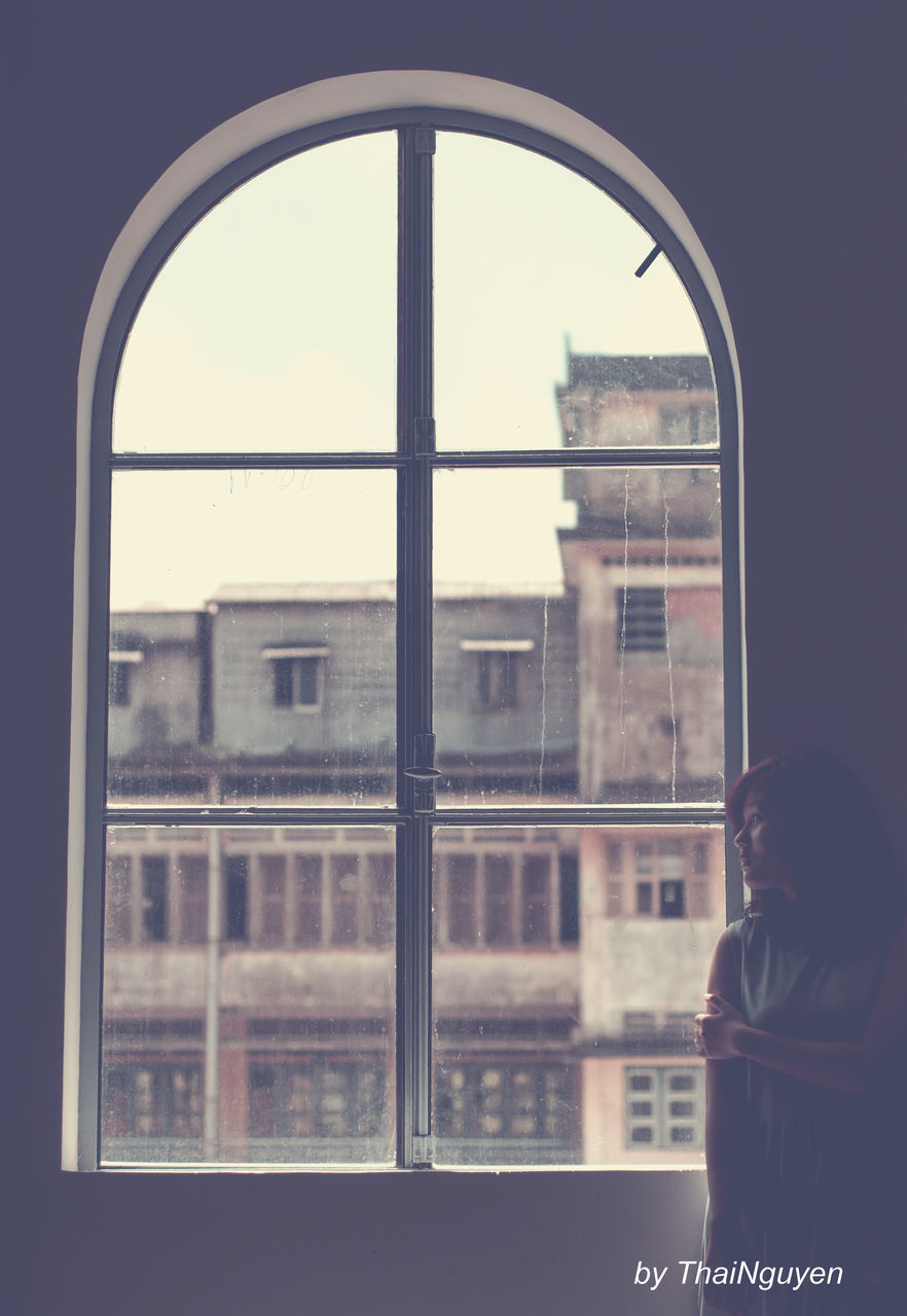 SILHOUETTE OF WOMAN IN CITY