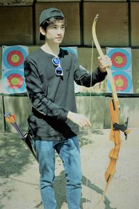 Full length of a young man looking away