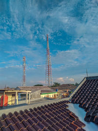 Buildings against cloudy sky