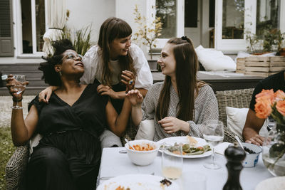 Group of people sitting on table