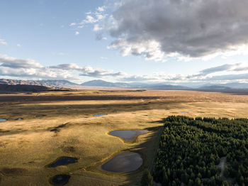 Drone view of grassland plain near lake tekapo, canterbury region of new zealand's south island.