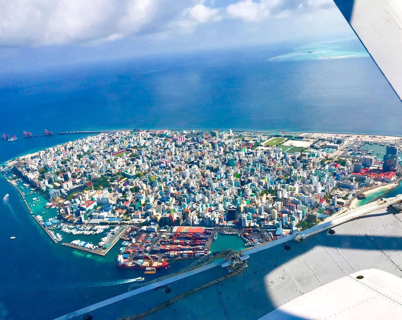 HIGH ANGLE VIEW OF CITY AGAINST SKY