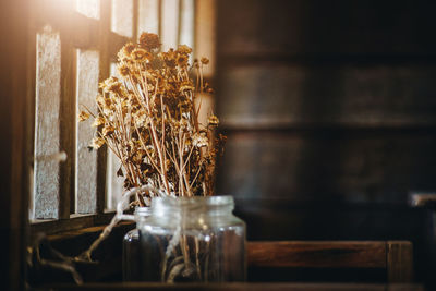 Close-up of glass jar on table at home