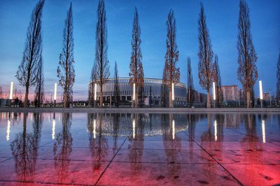 Panoramic view of buildings by city against sky