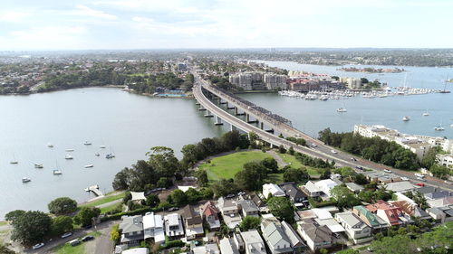 High angle view of bridge and buildings against sky