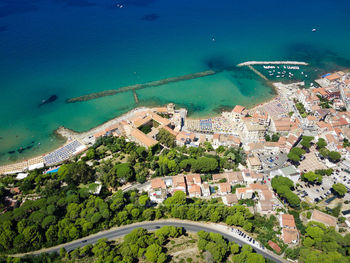 High angle view of buildings by sea