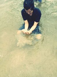 Young man in sea