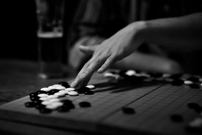 Close-up of hands playing on table