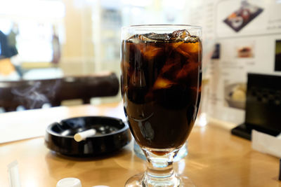 Close-up of iced coffee served on table