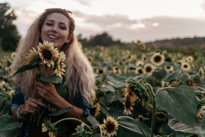 Portrait of smiling young woman outdoors