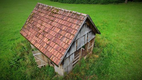 Abandoned house on field