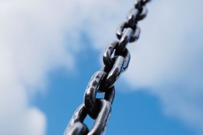 Strong steel chain for industry, blue background