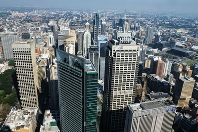 Aerial view of modern buildings in city against sky