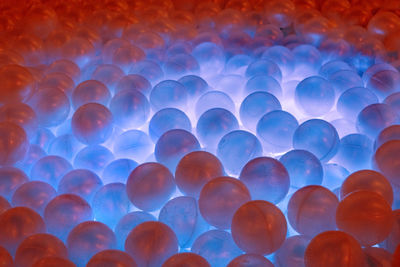 Low angle view of illuminated blue lights against sky