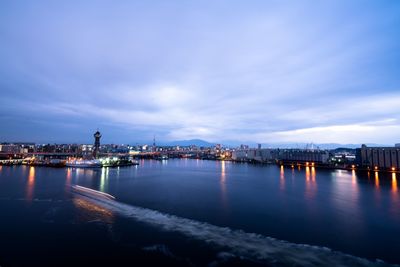 Illuminated city at waterfront