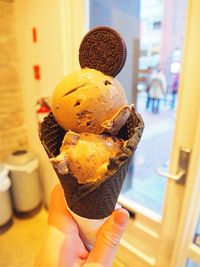 Close-up of woman holding ice cream cone