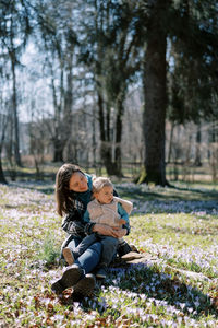 Young woman sitting on field