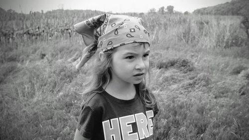 Portrait of teenage girl on field