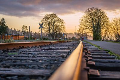 Surface level of railroad tracks against sky