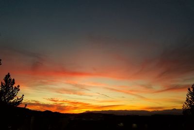 Low angle view of dramatic sky during sunset