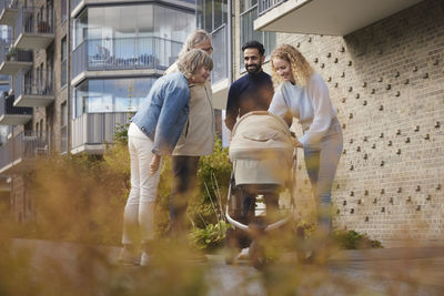 People in front of block of flats