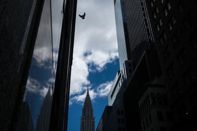 Low angle view of skyscrapers against sky