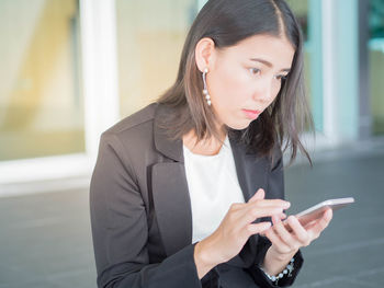 Young woman using mobile phone