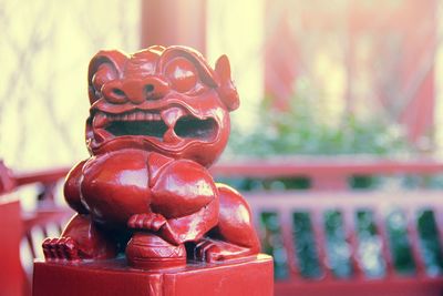 Close-up of red lion statue