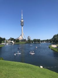 Scenic view of lake against clear blue sky
