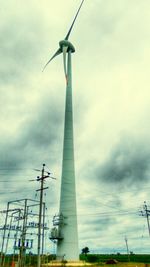 Low angle view of windmill against sky