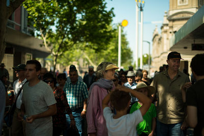 People standing on street in city