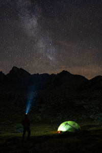 Scenic view of landscape against sky at night