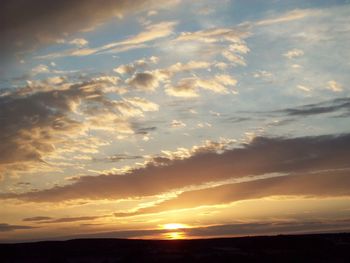 Low angle view of dramatic sky during sunset