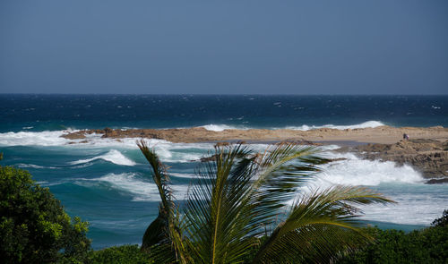 Scenic view of sea against clear blue sky