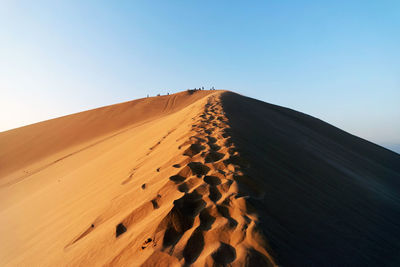 Scenic view of desert against clear sky