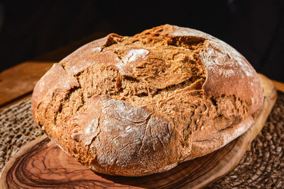 Freshly baked artisan rye bread on the table, close-up. homemade bread with whole wheat flour.