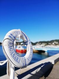 Close-up of ropes against clear blue sky