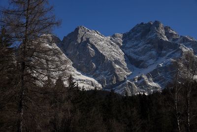 Scenic view of snowcapped mountains against clear sky