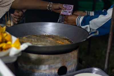 Close-up of person preparing food