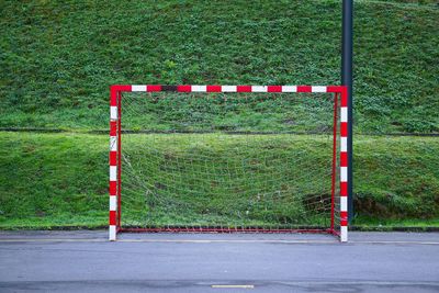 Goal post on soccer field against grass