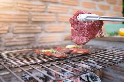 Close-up of meat on barbecue grill