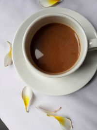 High angle view of coffee cup on table