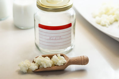 Close-up of ice cream in jar on table