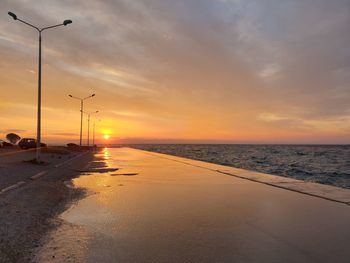 Scenic view of beach against sky during sunset
