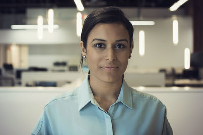 Young woman working in office, portrait