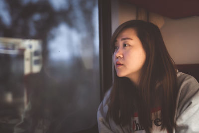 Portrait of young woman looking away