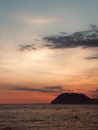 Scenic view of sea against sky at sunset