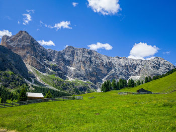 Scenic view of landscape and mountains against sky