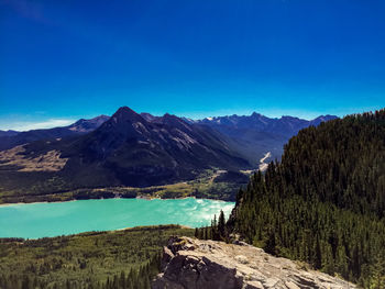 Scenic view of mountains against clear blue sky