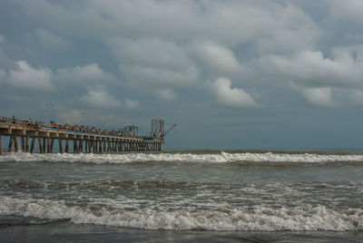 Pier over sea against sky